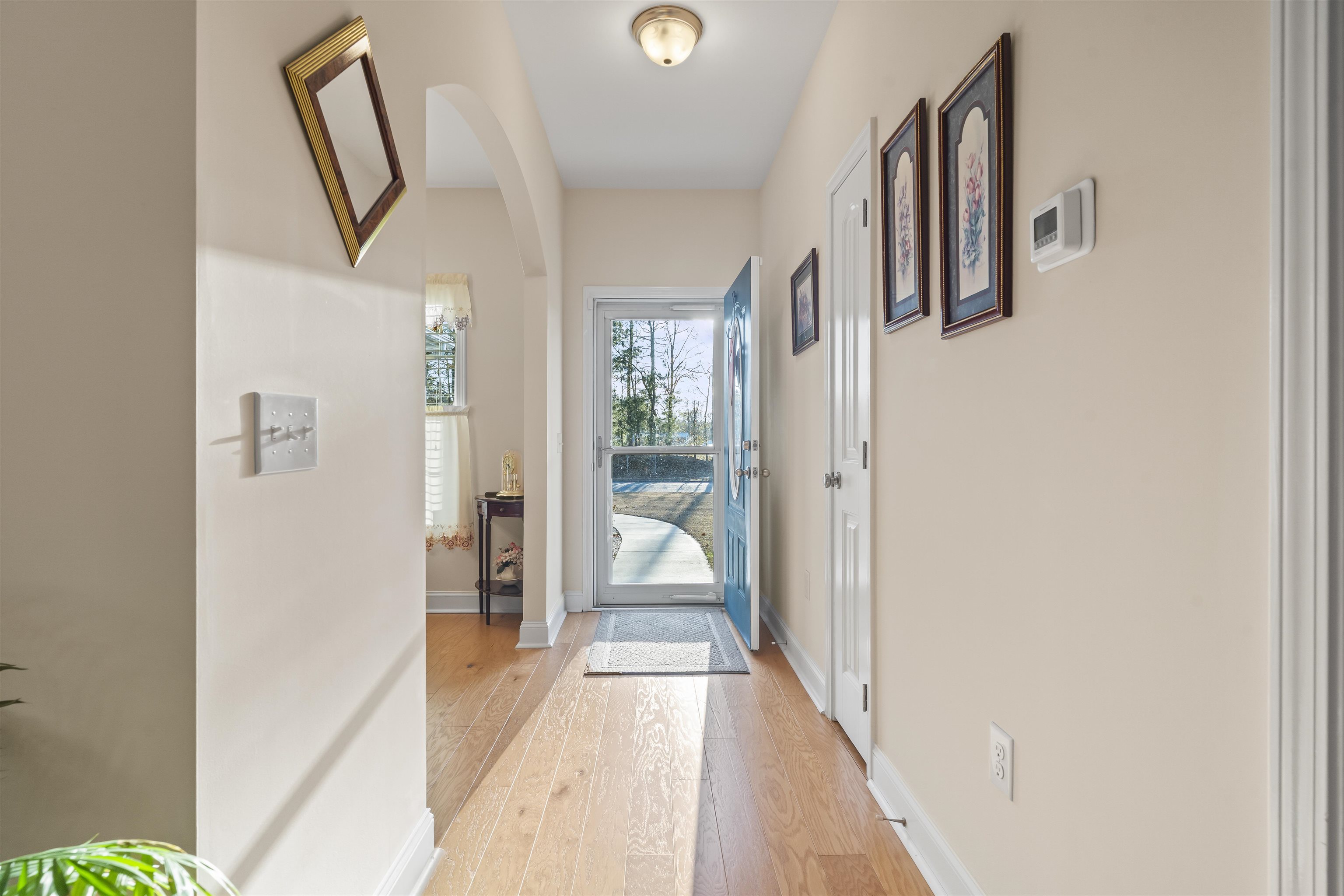 830 Payne Court Conway, SC 29526 - Photo 4 of 38 Entryway with arched walkways and hardwood / wood-style floors