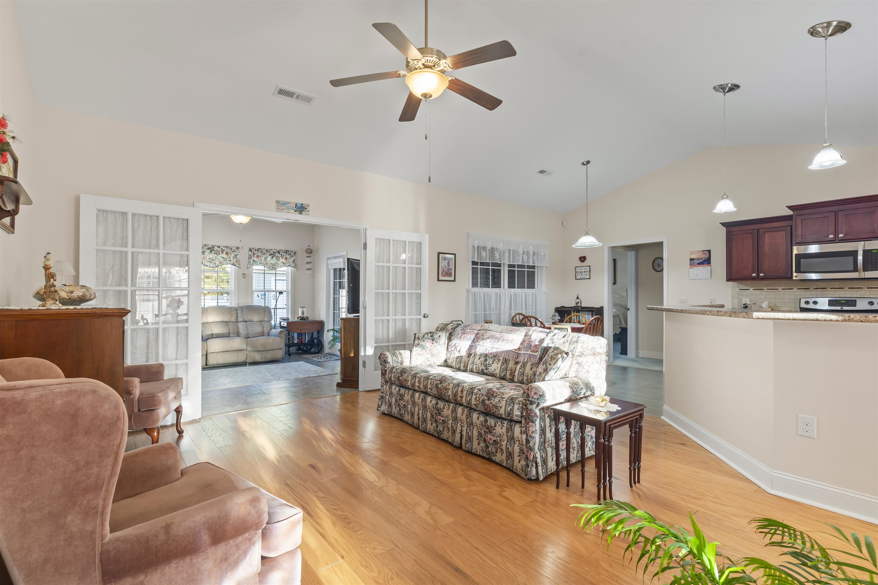 830 Payne Court Conway, SC 29526 - Photo 8 of 38 Living room featuring a ceiling fan, light wood-style flooring, french doors, and high vaulted ceiling