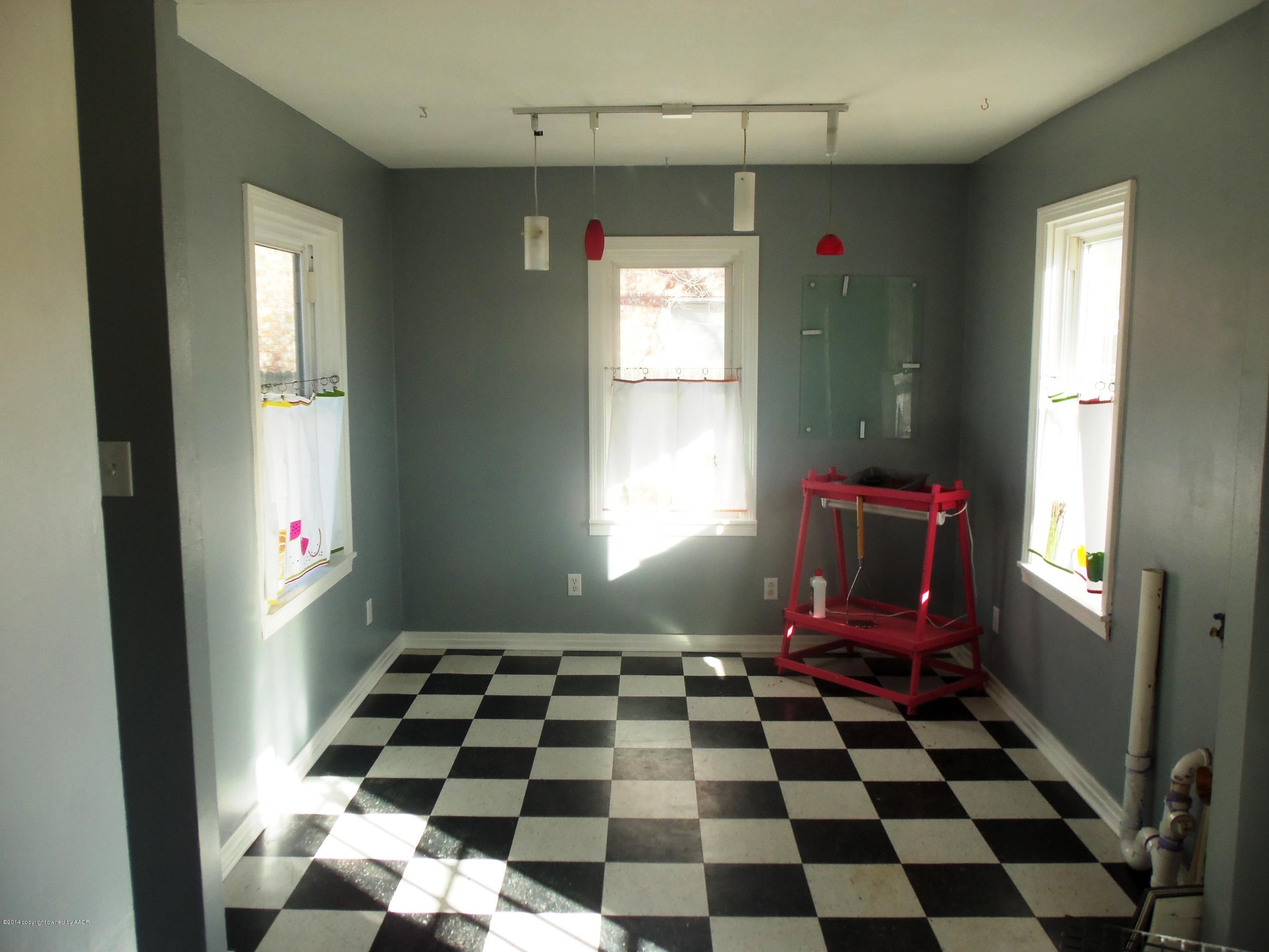 4307 Parker Street Amarillo, TX 79110 - Photo 8 of 16 a room with black and white checkered floor