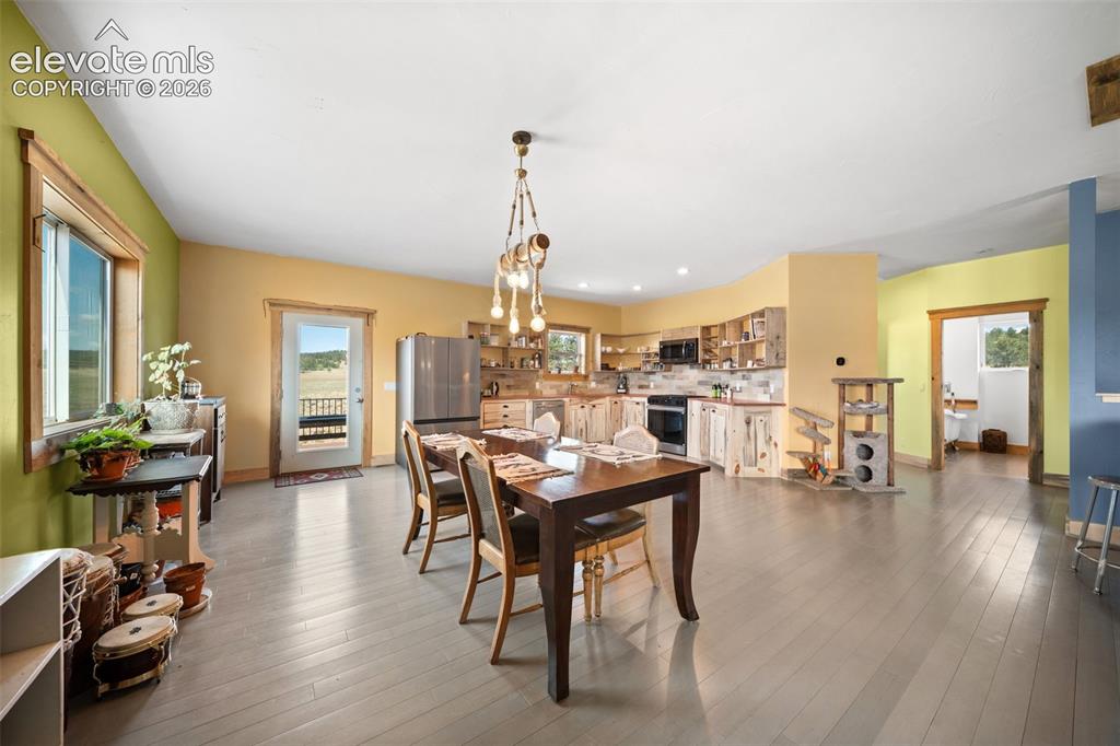351 High Pasture Road Florissant, CO 80816 - Photo 8 of 39 Spacious dining area opens seamlessly to the kitchen.