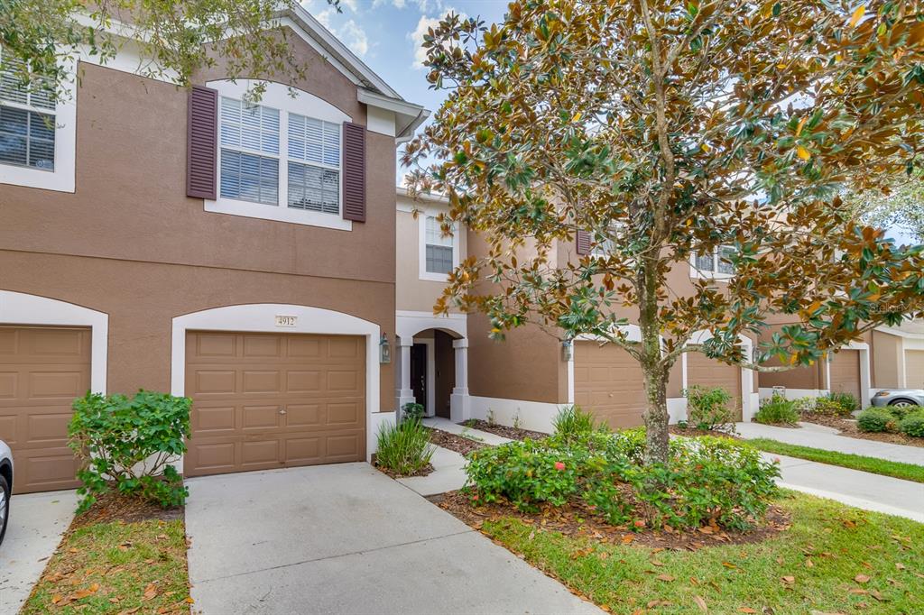 4912 Pond Ridge Drive Riverview, FL 33578 - Photo 1 of 1 a front view of a house with garden