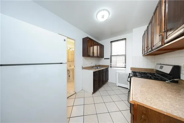 a kitchen with stainless steel appliances granite countertop a stove and a sink
