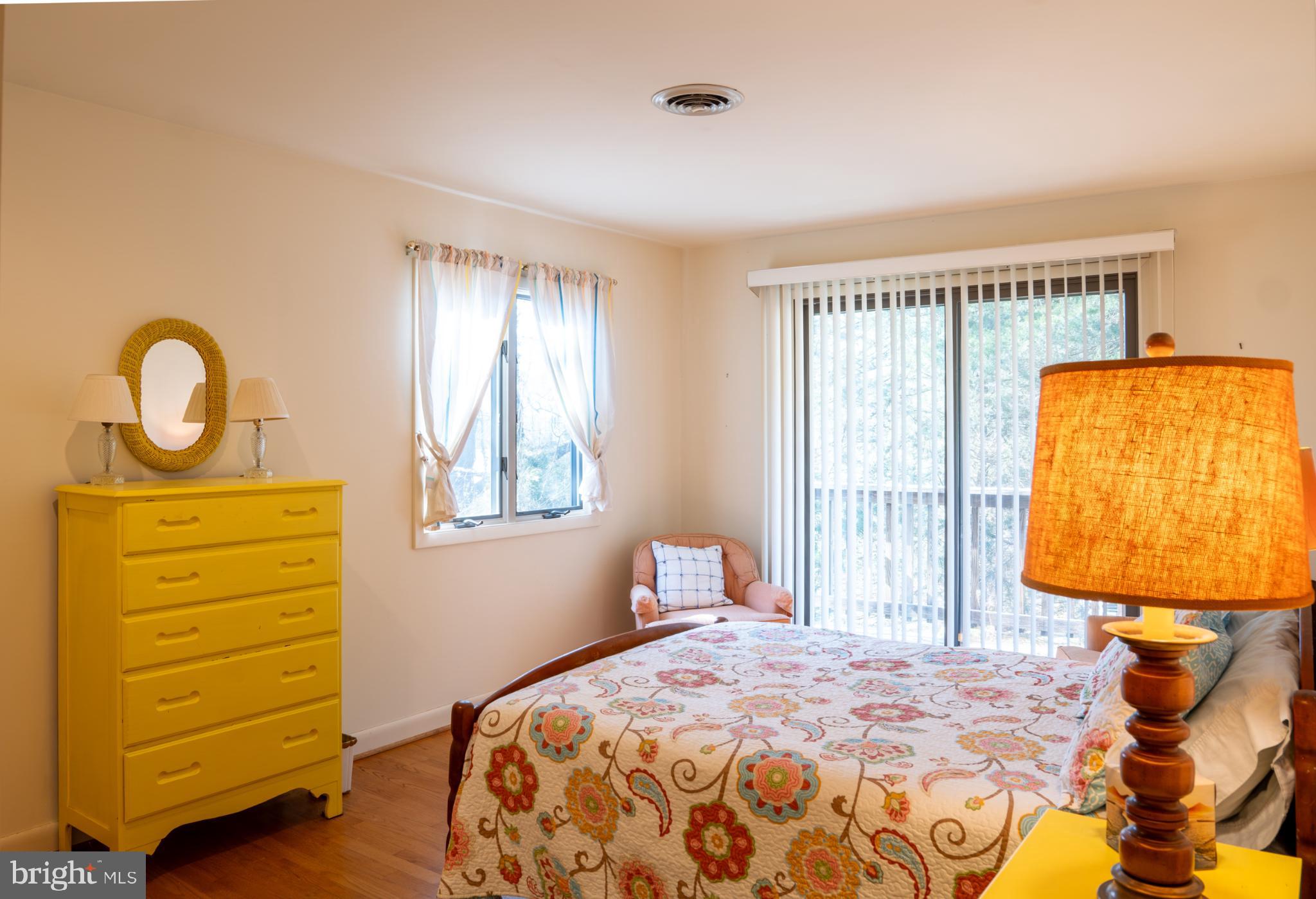 162 Youcomico Drive Lancaster, VA 22503 - Photo 19 of 31 a bedroom with a bed and a window