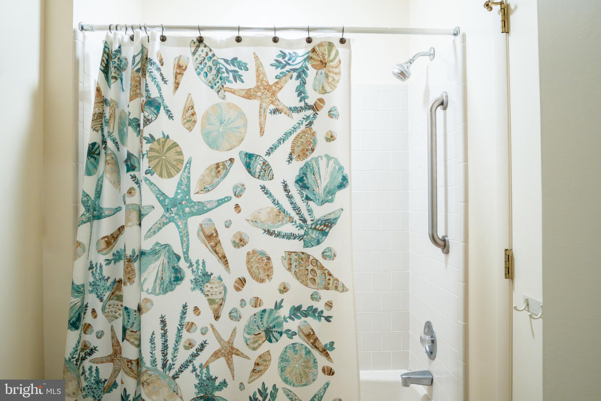 162 Youcomico Drive Lancaster, VA 22503 - Photo 23 of 31 a bathroom with a shower curtain and a shower curtain