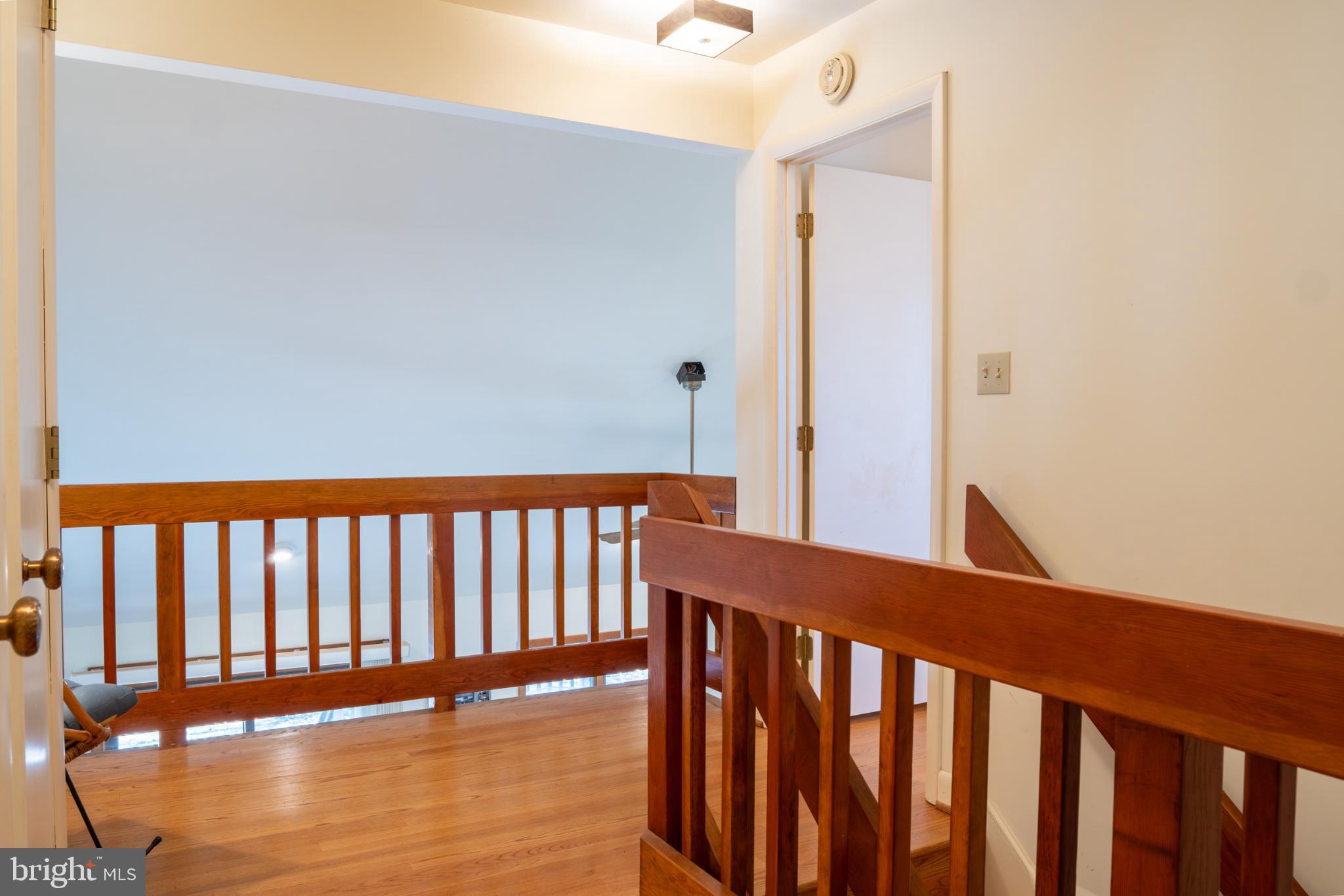 162 Youcomico Drive Lancaster, VA 22503 - Photo 26 of 31 a view of staircase with railing and white walls