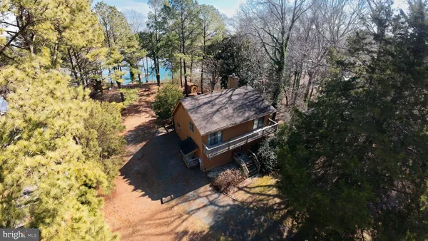 a view of a backyard with chairs