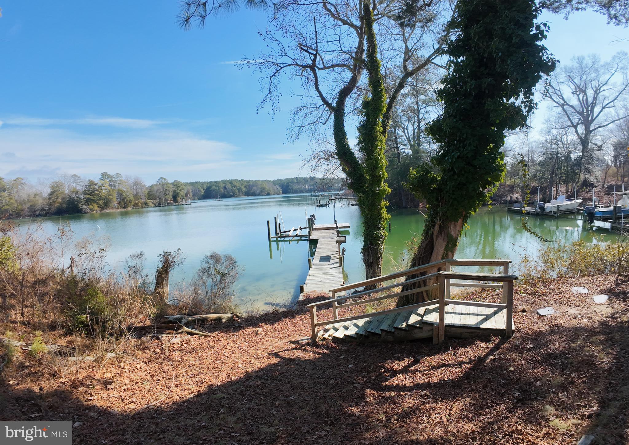162 Youcomico Drive Lancaster, VA 22503 - Photo 3 of 31 a view of a lake with a mountain