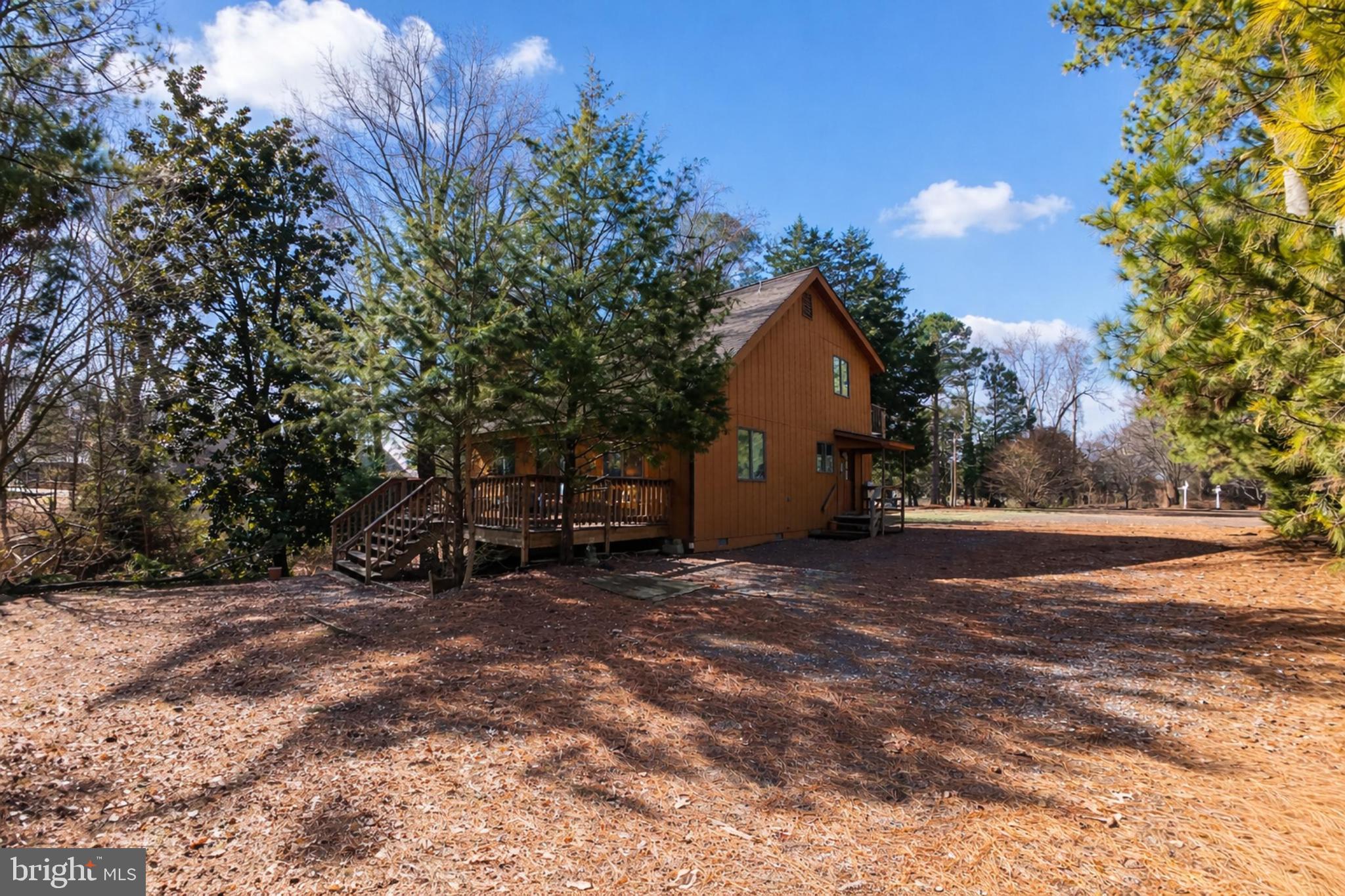 162 Youcomico Drive Lancaster, VA 22503 - Photo 31 of 31 a view of a house with a yard and garage