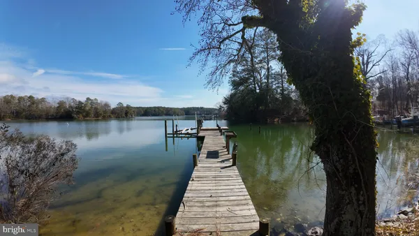 a lake view with a wooden bridge