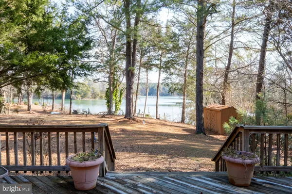 a view of a balcony with wooden floor