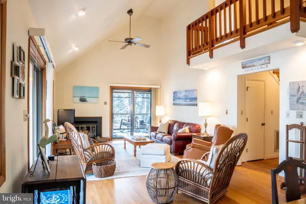 a living room with furniture fireplace and a flat screen tv