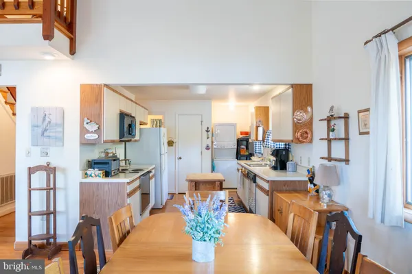 a very nice looking living room with kitchen and furniture