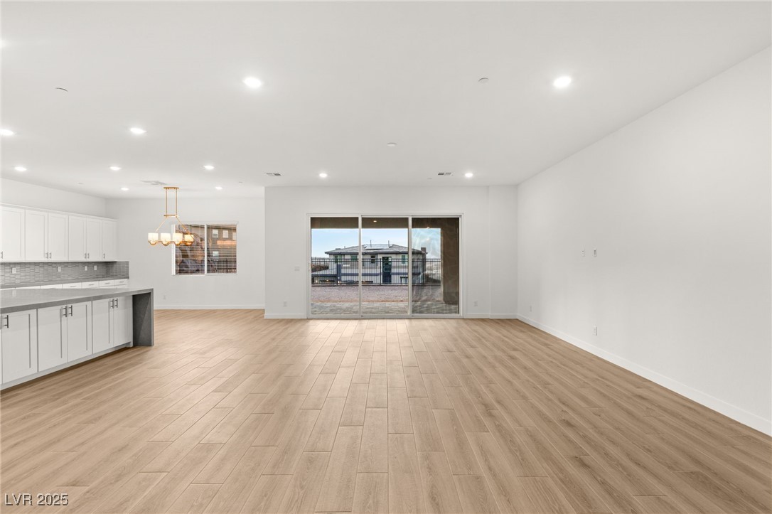 522 Riley Ridge Henderson, NV 89012 - Photo 7 of 53 Living room with recessed lighting, light wood-style floors