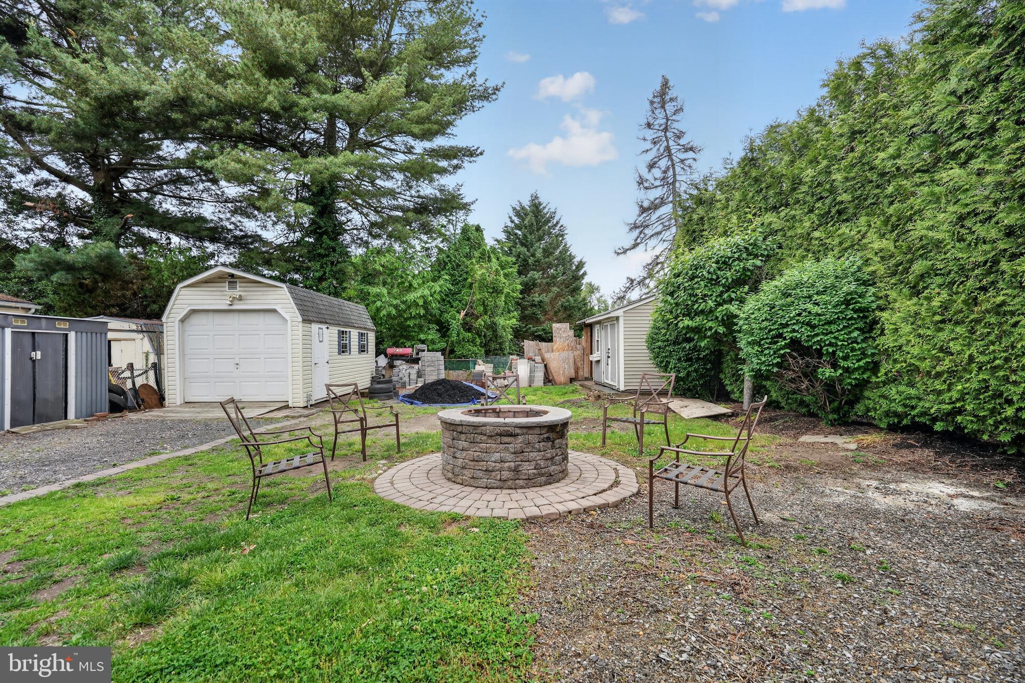 106 Ford Street Voorhees, NJ 08043 - Photo 36 of 36 a view of a backyard with table and chairs potted plants and a large tree