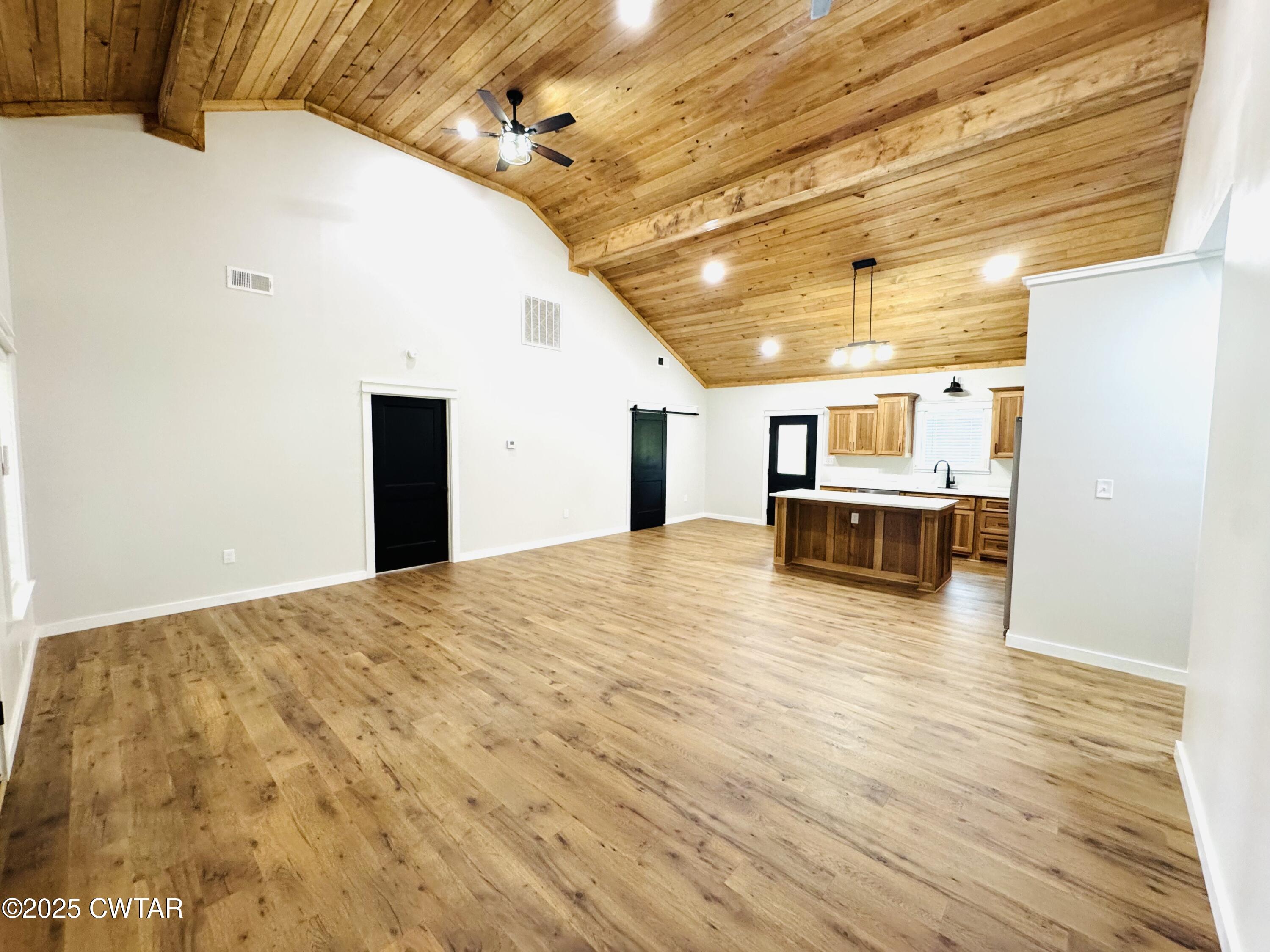 2000 Feddie Davis Road Ramer, TN 38367 - Photo 6 of 22 a view of a room with wooden floor