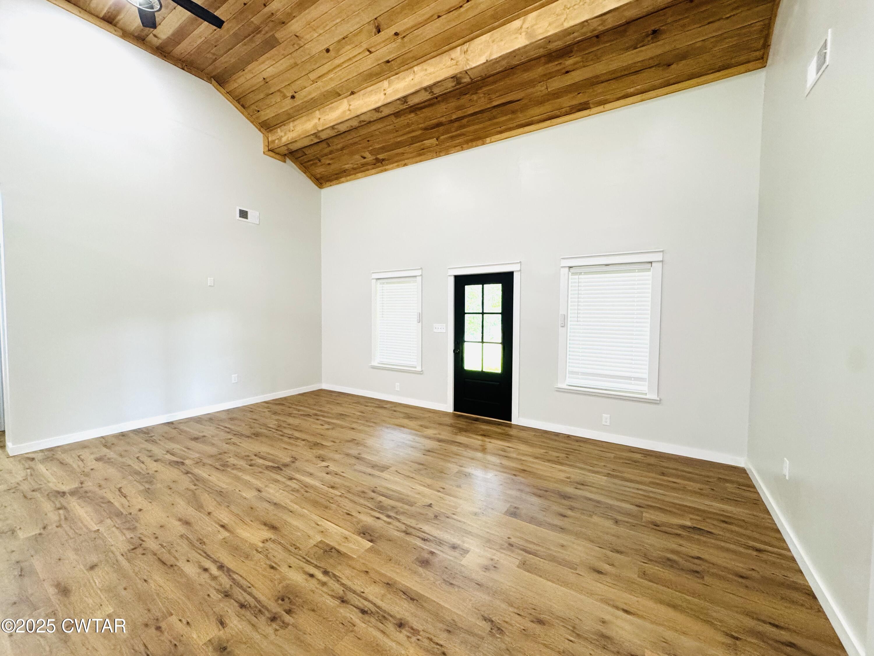 2000 Feddie Davis Road Ramer, TN 38367 - Photo 7 of 22 a view of empty room with wooden floor and fan