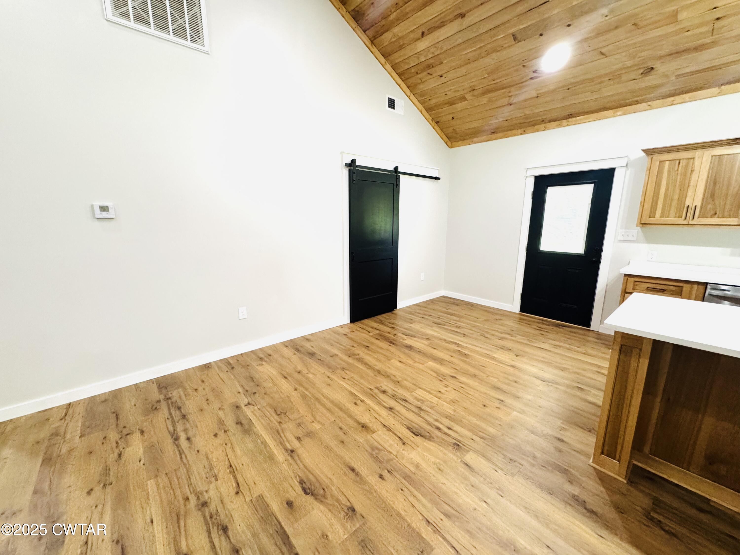 2000 Feddie Davis Road Ramer, TN 38367 - Photo 8 of 22 a bedroom with a bed and wooden floor