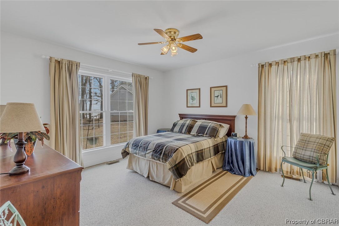 1243 Fox Point Road Reedville, VA 22539 - Photo 38 of 44 Carpeted bedroom with ceiling fan
