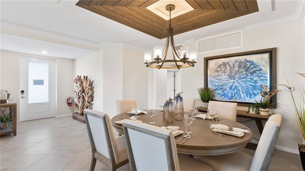 15170 Bluffton Lane, Unit 1811 Babcock Ranch, FL 33982 - Photo 15 of 20 a view of a dining room with furniture wooden floor and chandelier
