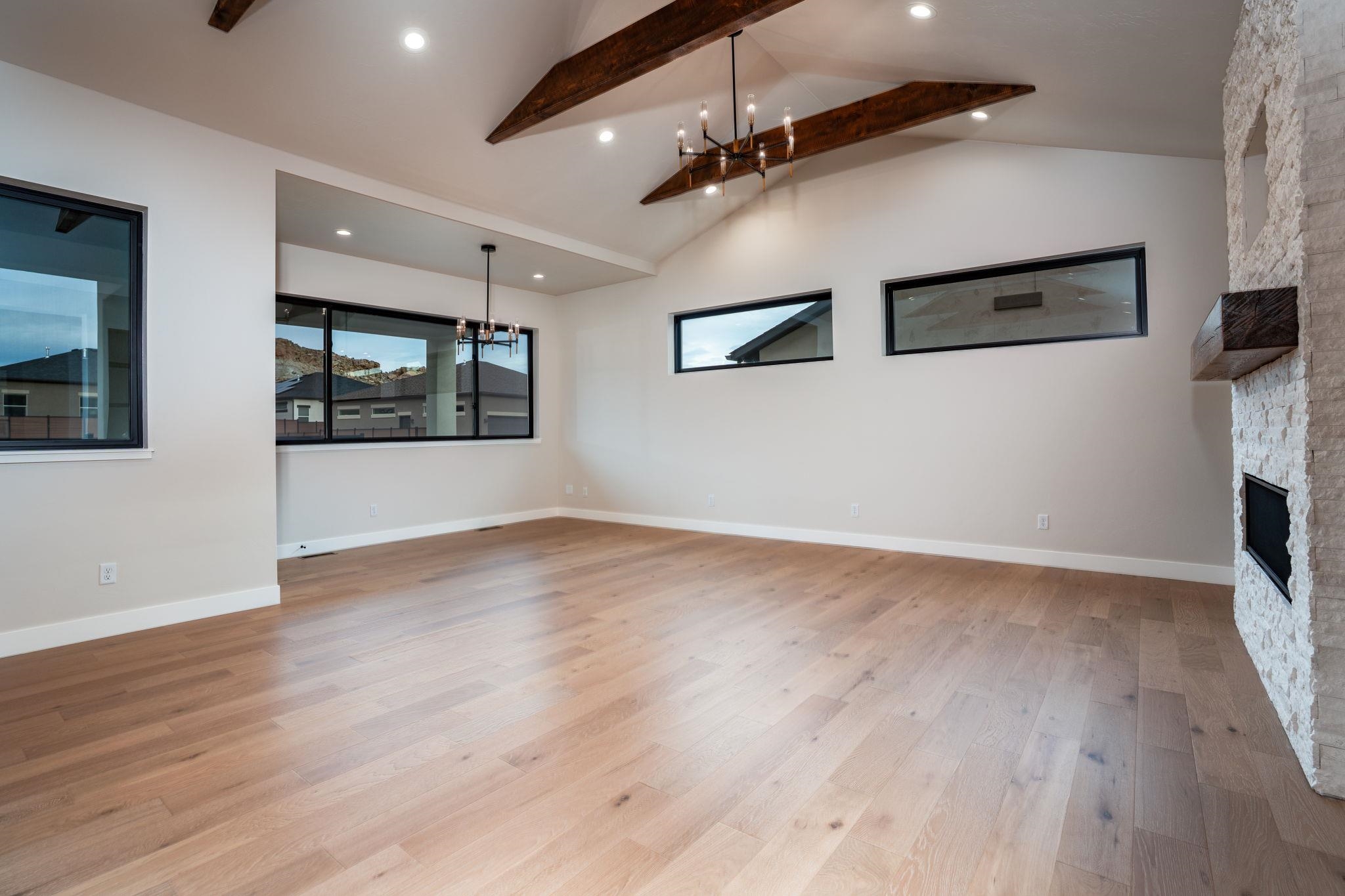 2304 Trail Ridge Road Grand Junction, CO 81507 - Photo 13 of 33 an empty room with wooden floor and windows