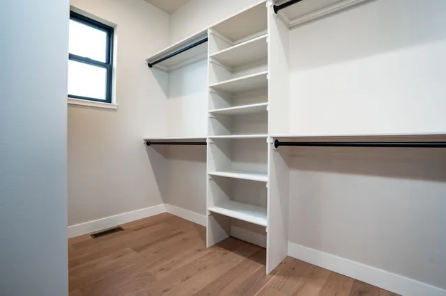 a view of an empty walk in closet