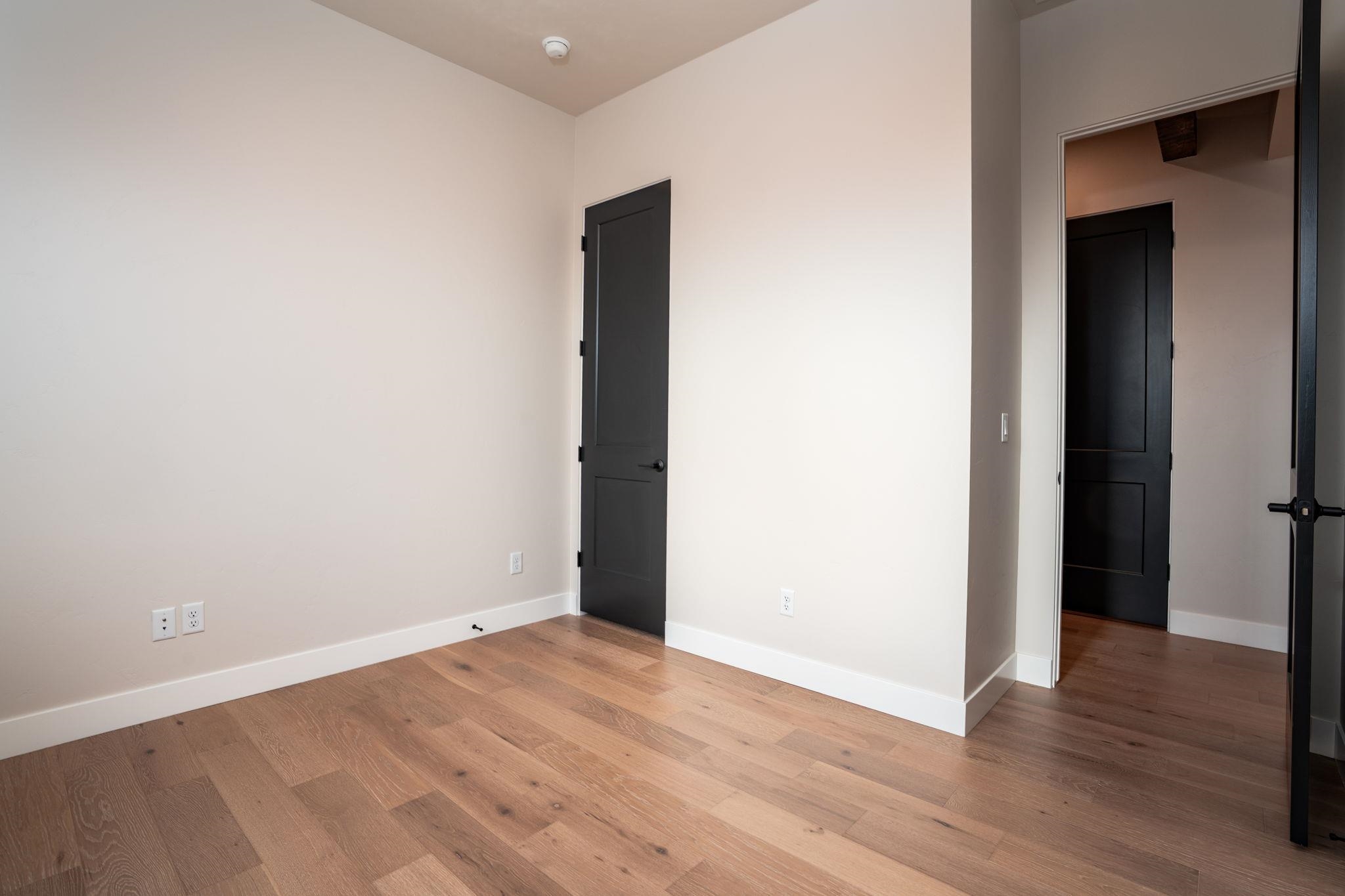 2304 Trail Ridge Road Grand Junction, CO 81507 - Photo 23 of 33 a view of an empty room with wooden floor