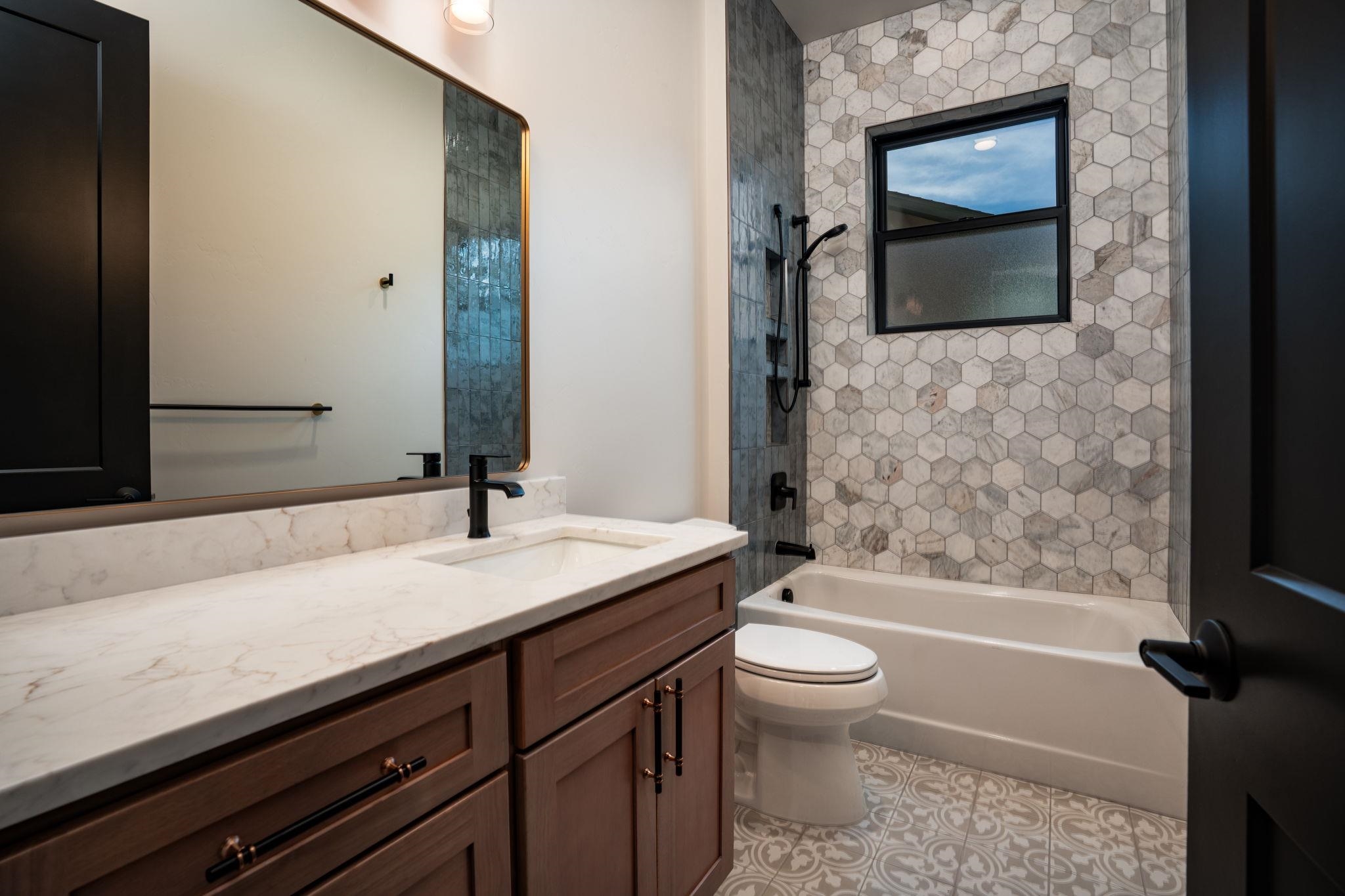 2304 Trail Ridge Road Grand Junction, CO 81507 - Photo 24 of 33 a bathroom with a sink a toilet and shower