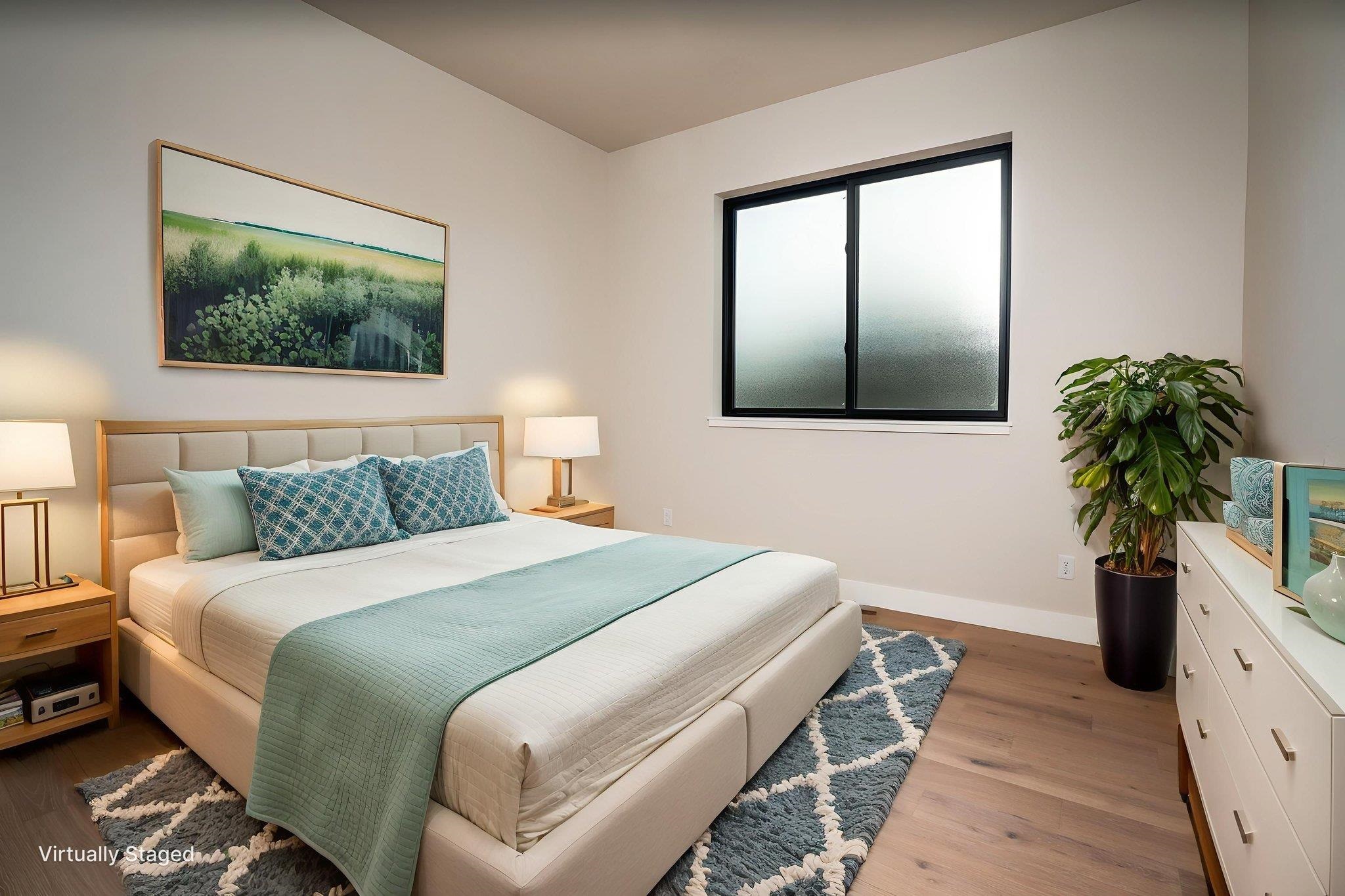 2304 Trail Ridge Road Grand Junction, CO 81507 - Photo 25 of 33 a bedroom with a bed and a potted plant next to a window