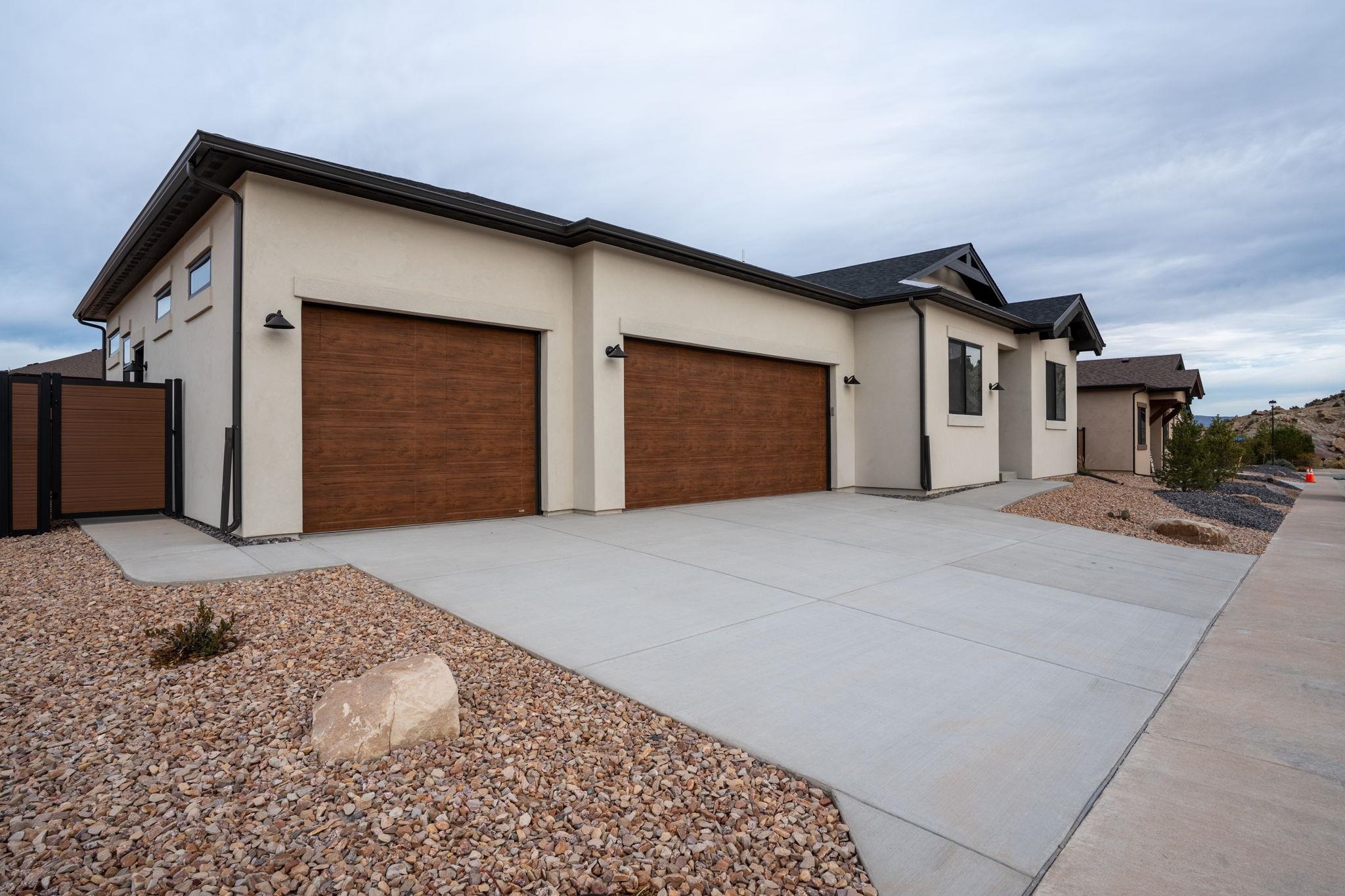 2304 Trail Ridge Road Grand Junction, CO 81507 - Photo 32 of 33 a front view of a house with a yard and garage