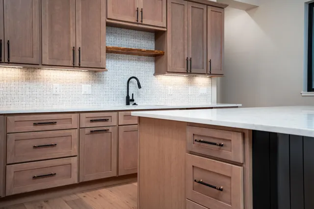 a kitchen with appliances cabinets and a counter top space