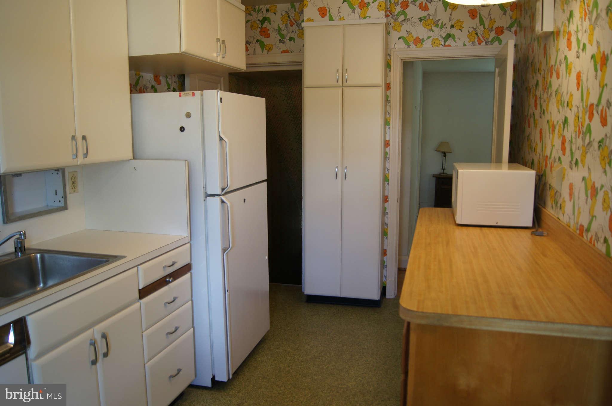 415 Murdock Road Baltimore, MD 21212 - Photo 14 of 30 a kitchen with a refrigerator sink and stove