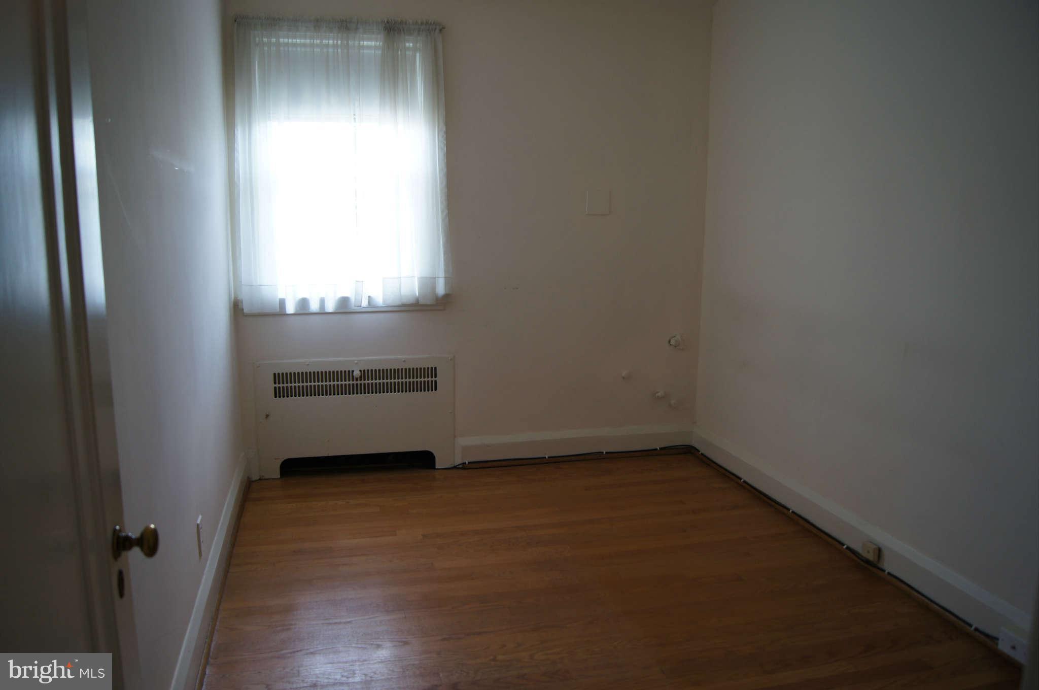 415 Murdock Road Baltimore, MD 21212 - Photo 22 of 30 a view of an empty room and a window