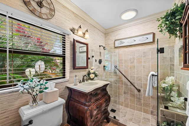 a bathroom with a sink toilet and shower