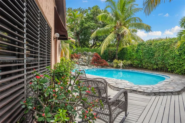 a view of outdoor sitting space with furniture
