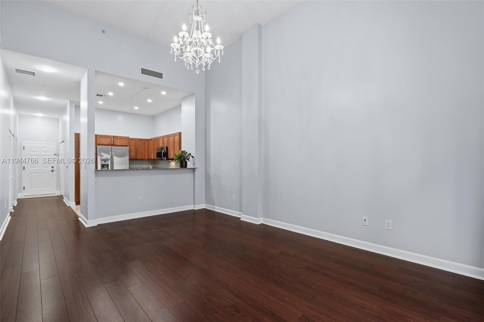 8395 Southwest 73rd Avenue, Unit 314 Miami, FL 33143 - Photo 15 of 49 a view of a kitchen with wooden floor and a kitchen