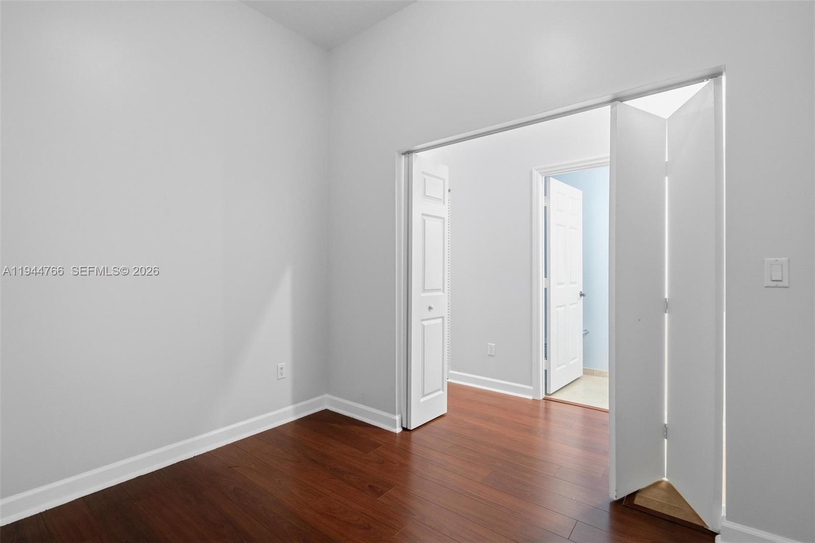 8395 Southwest 73rd Avenue, Unit 314 Miami, FL 33143 - Photo 27 of 49 a view of an empty room with wooden floor