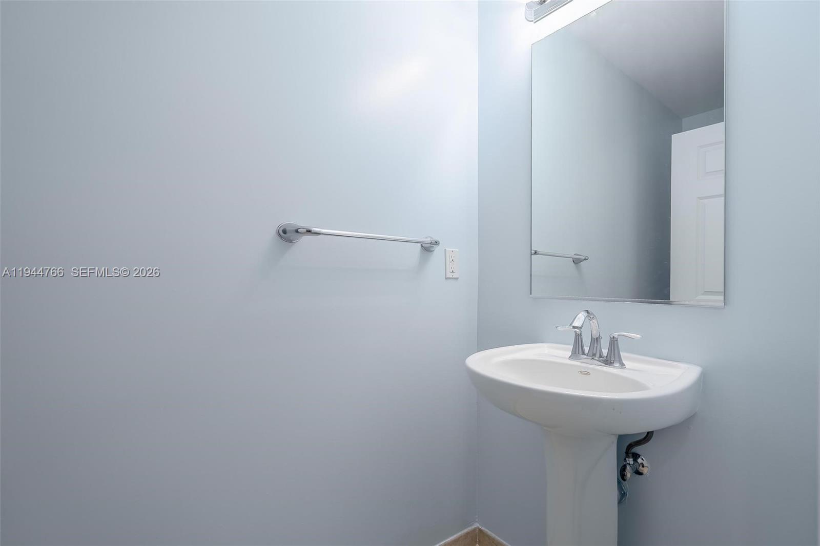 8395 Southwest 73rd Avenue, Unit 314 Miami, FL 33143 - Photo 31 of 49 a bathroom with a sink and a mirror