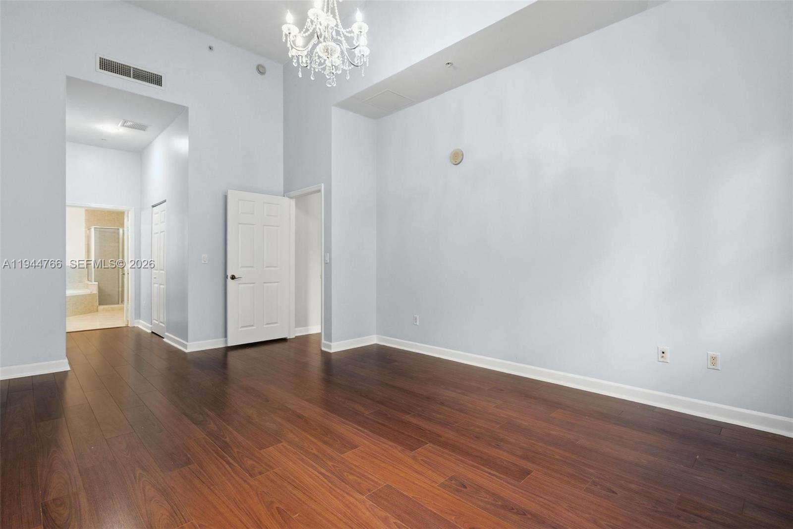 8395 Southwest 73rd Avenue, Unit 314 Miami, FL 33143 - Photo 34 of 49 a view of an empty room with wooden floor