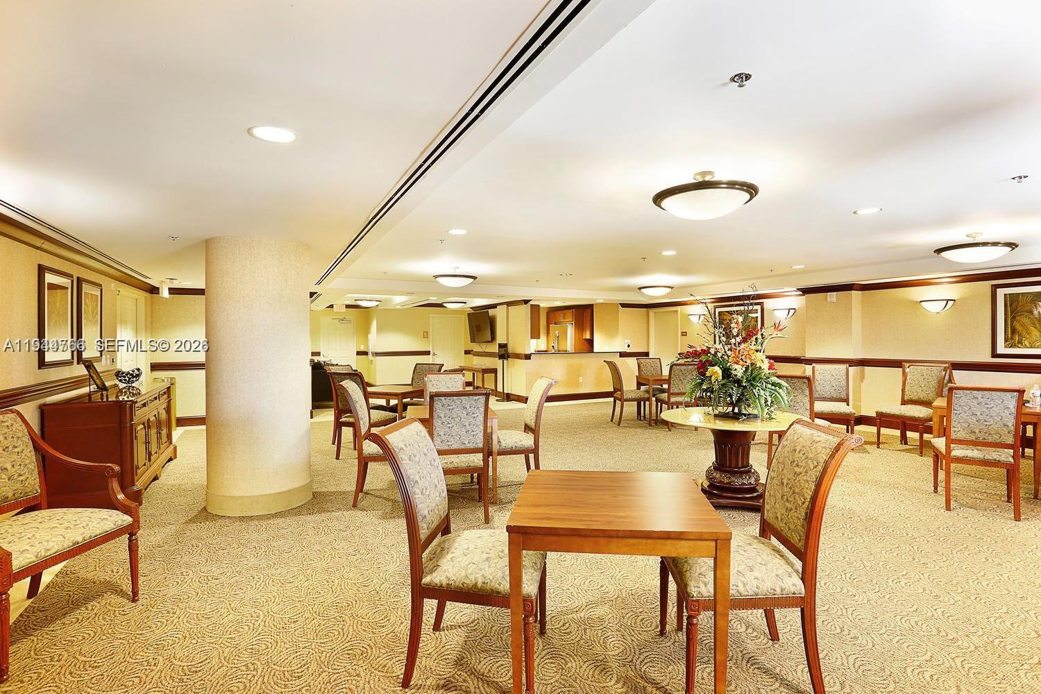 8395 Southwest 73rd Avenue, Unit 314 Miami, FL 33143 - Photo 41 of 49 a dining room with lots of furniture and chandelier