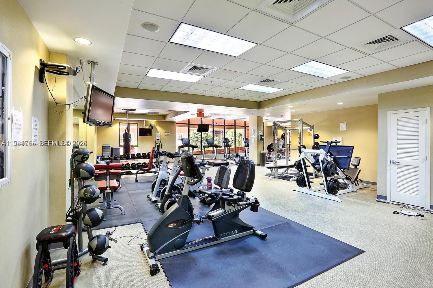 8395 Southwest 73rd Avenue, Unit 314 Miami, FL 33143 - Photo 44 of 49 a view of a room with gym equipment