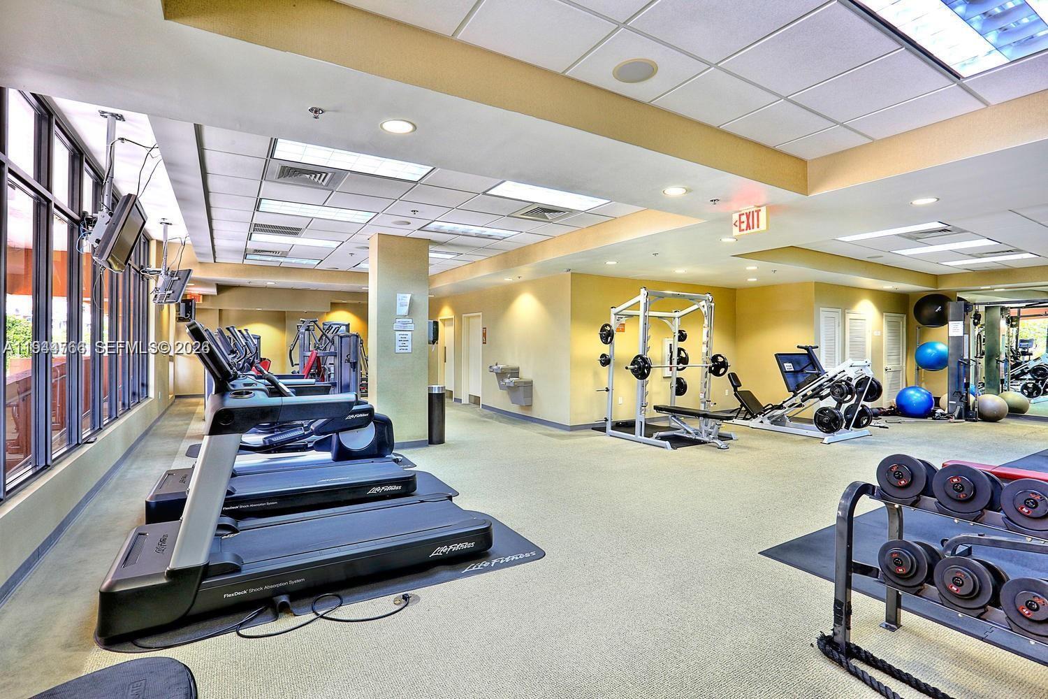 8395 Southwest 73rd Avenue, Unit 314 Miami, FL 33143 - Photo 45 of 49 a view of a room with gym equipment