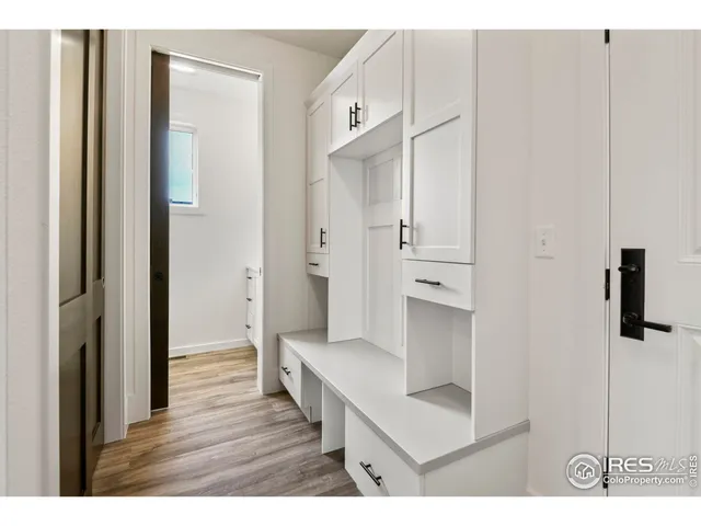 a bathroom with a granite countertop sink and a white cabinet