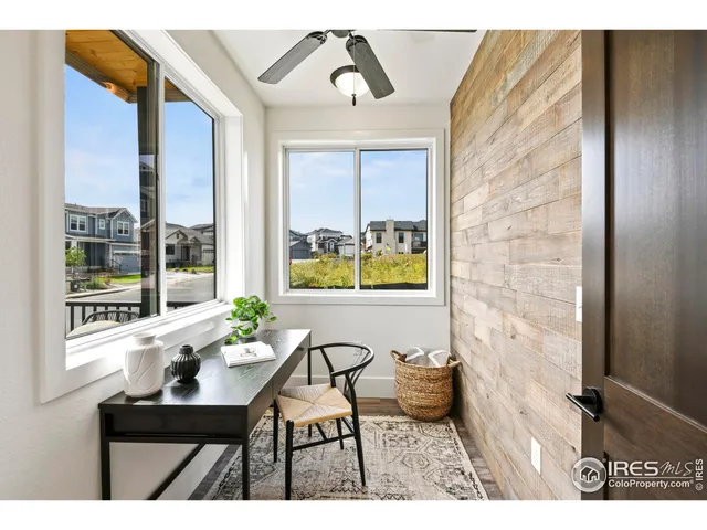 a balcony with table and chairs
