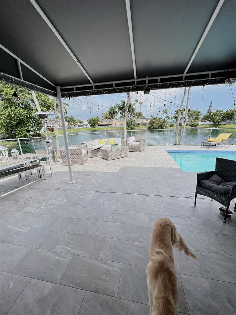 9357 Southwest 145th Place Miami, FL 33186 - Photo 15 of 15 a view of room that has a couch and a table in it