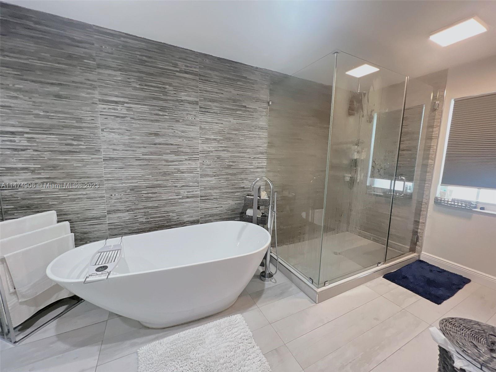 9357 Southwest 145th Place Miami, FL 33186 - Photo 6 of 15 a bathroom with a bathtub and shower