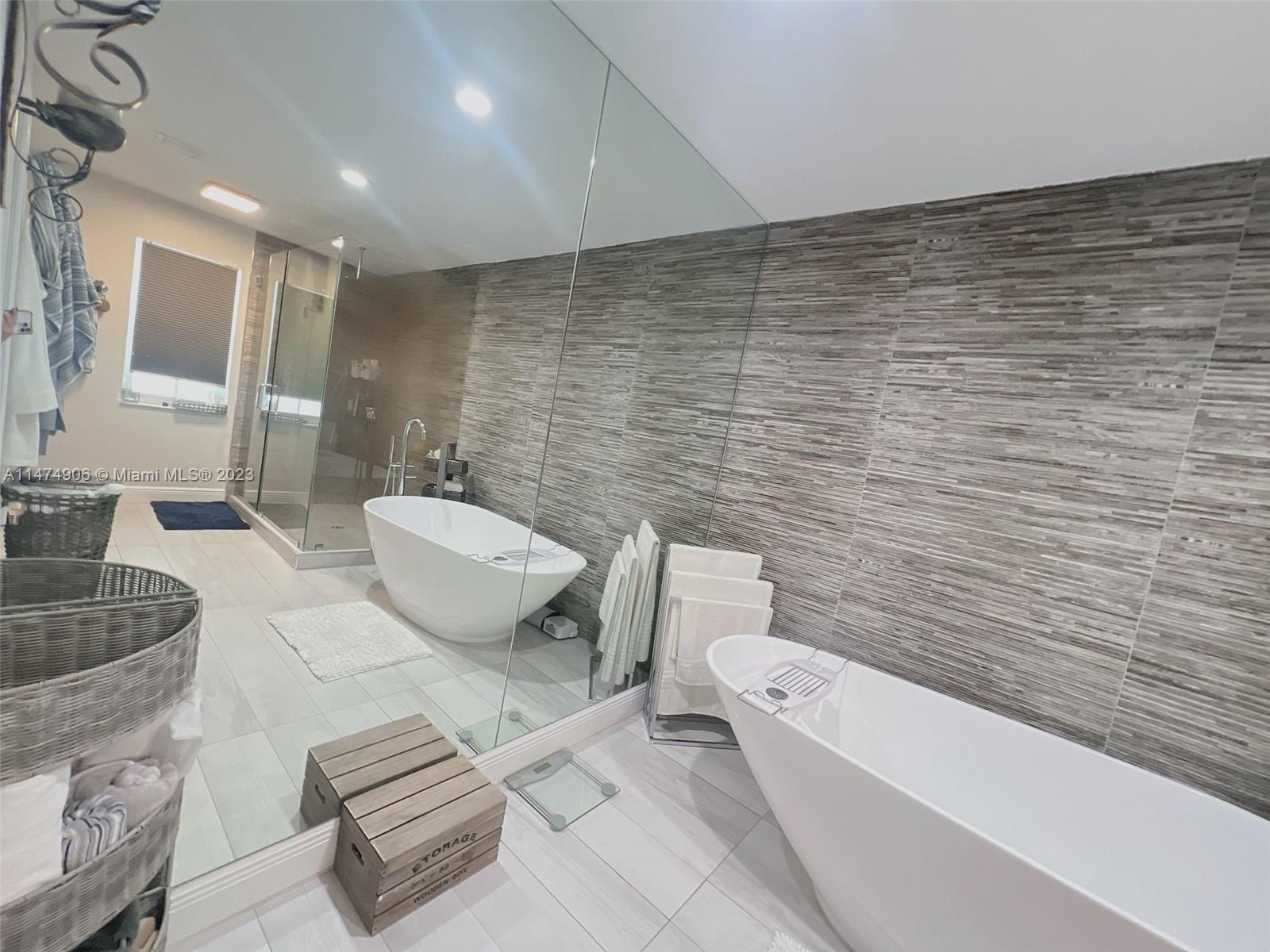 9357 Southwest 145th Place Miami, FL 33186 - Photo 7 of 15 a bathroom with a toilet a sink and mirror