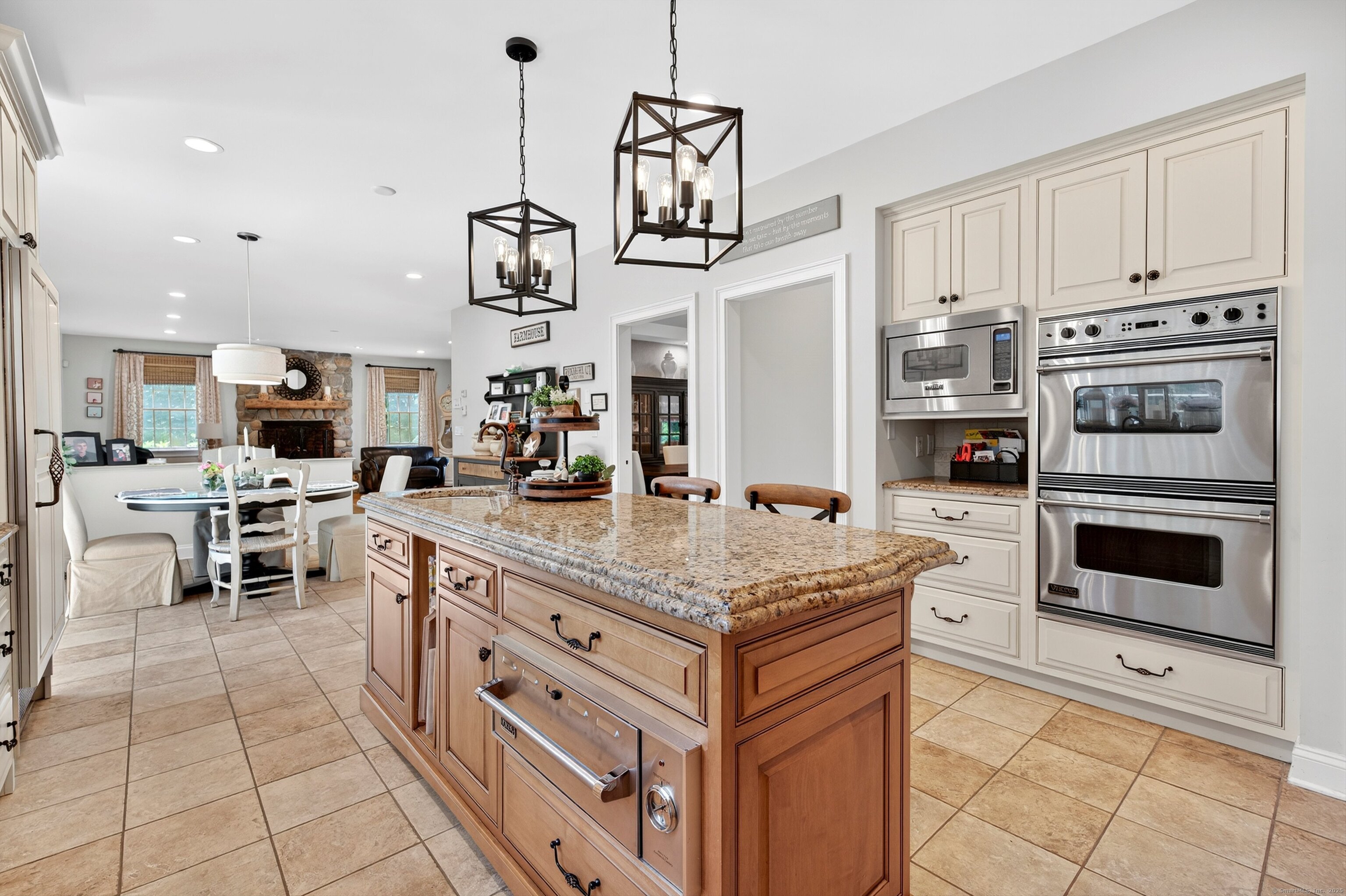 99 Carriage Lane Roxbury, CT 06783 - Photo 11 of 38 a kitchen with stainless steel appliances granite countertop a stove and cabinets