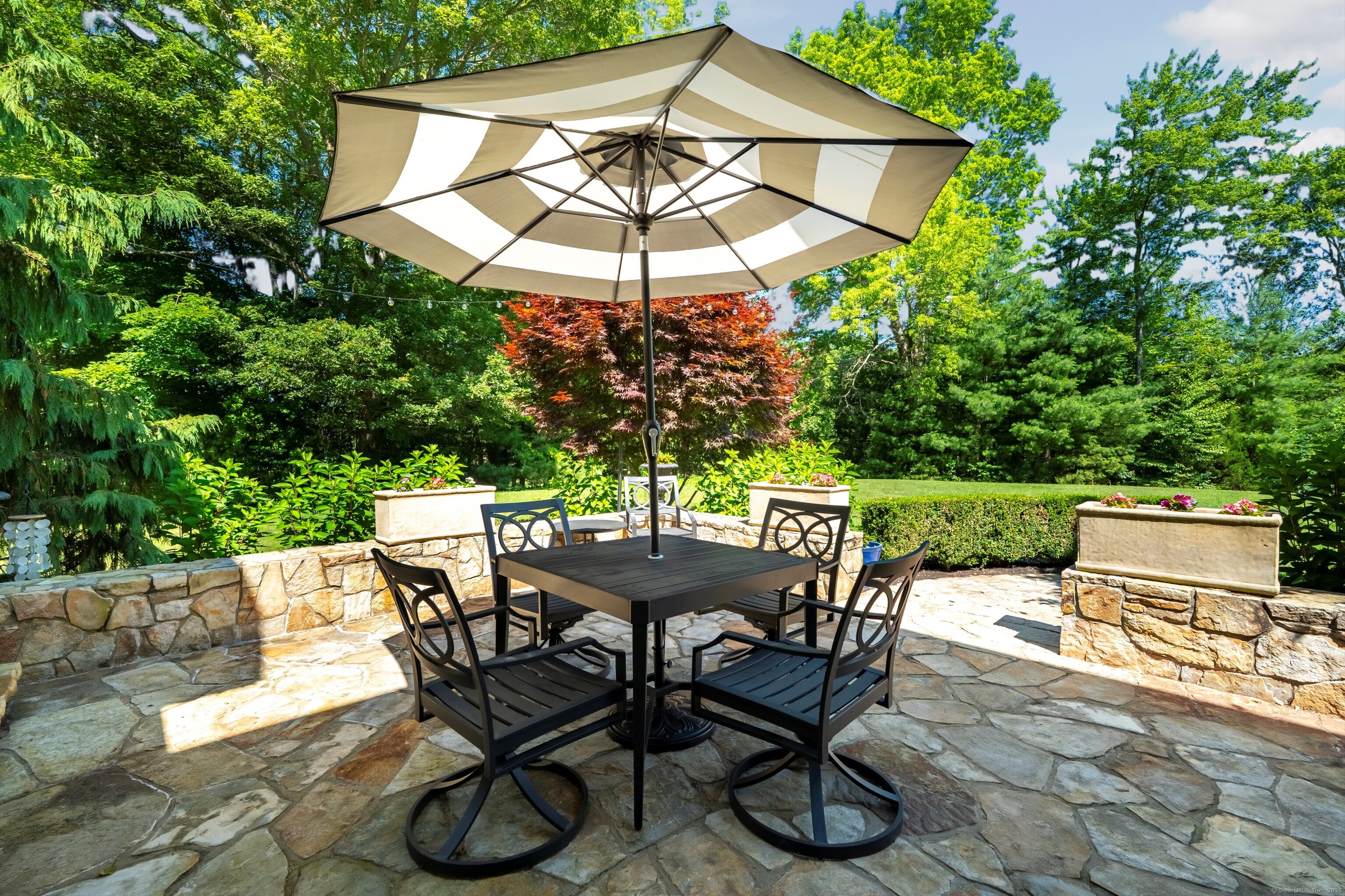 99 Carriage Lane Roxbury, CT 06783 - Photo 12 of 38 a view of an outdoor sitting area with furniture and a backyard