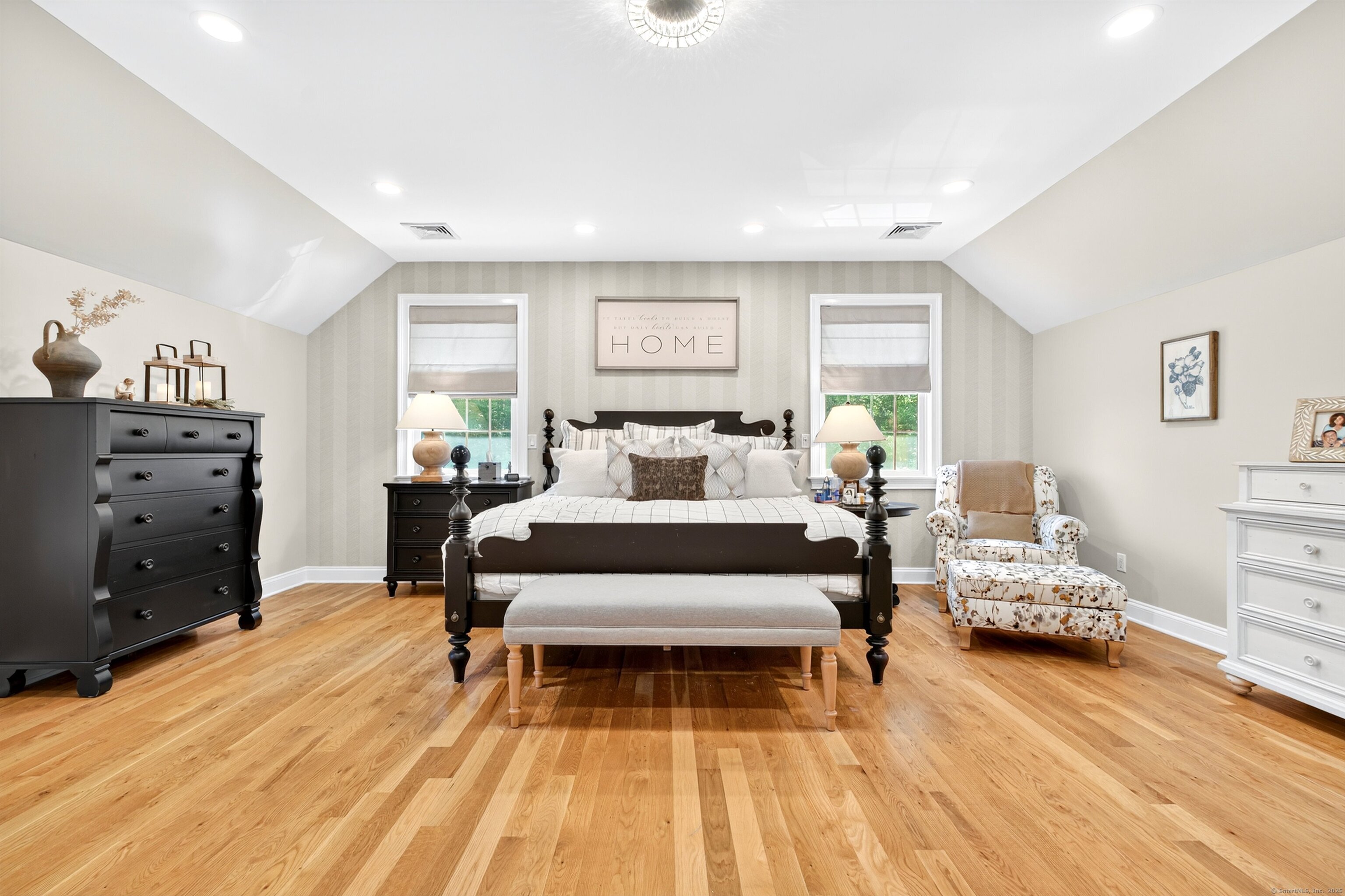 99 Carriage Lane Roxbury, CT 06783 - Photo 17 of 38 a bedroom with a bed and wooden floor