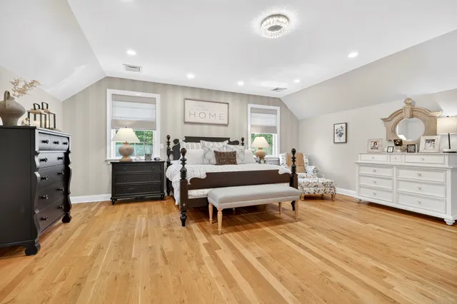 a bedroom with furniture and a dresser